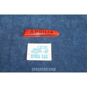 APRILIA   PLASTICA ARANCIONE SCRITTA "APRILIA" PER LUCE TARGA